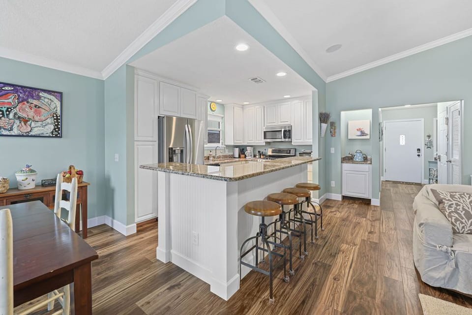 Open kitchen with bar seating and layout