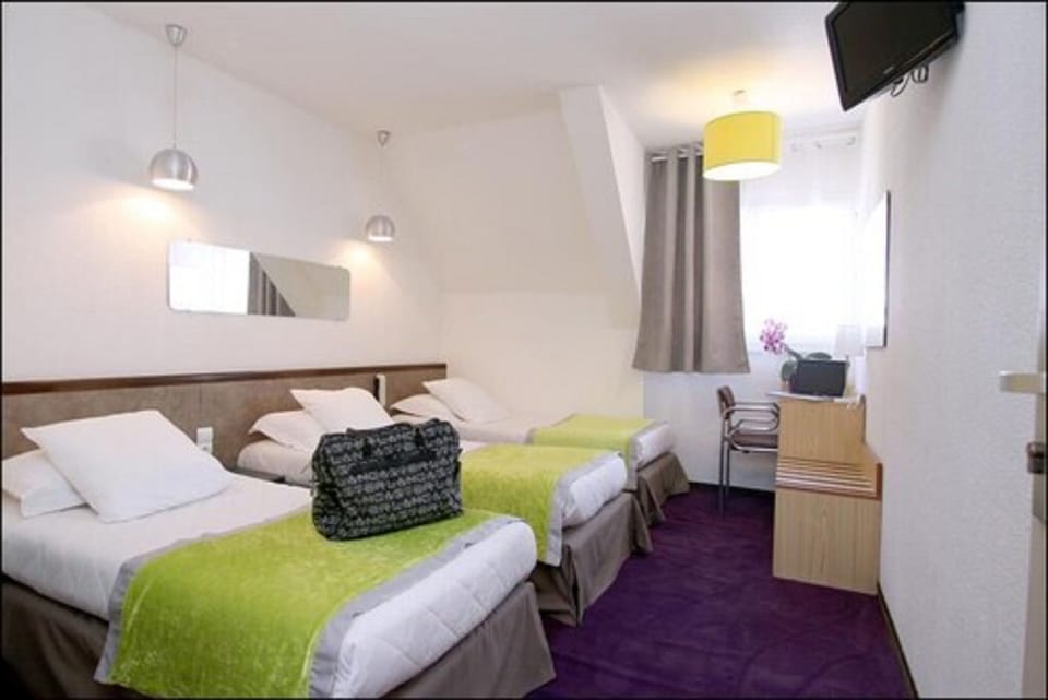 Triple Room | Individually decorated, individually furnished, blackout drapes