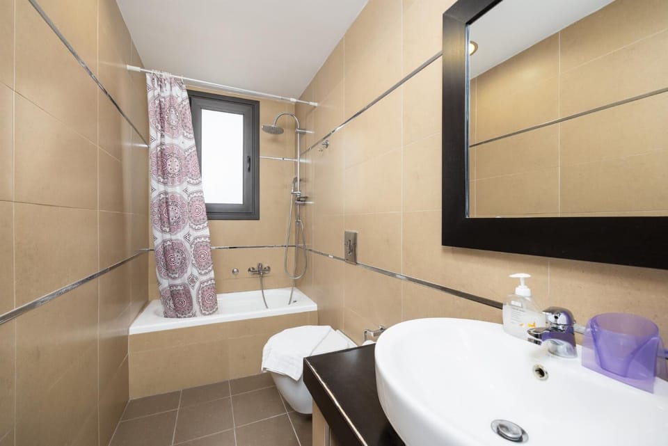 Family bathroom with bath and shower