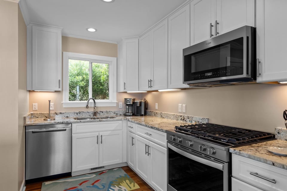 Your fully equipped kitchen features granite countertops, stainless steel appliances, and everything you need to create memorable meals during your stay.
