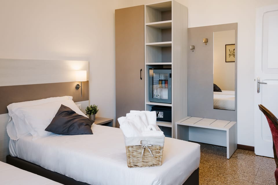 Standard Double or Twin Room | Minibar, in-room safe, desk, laptop workspace