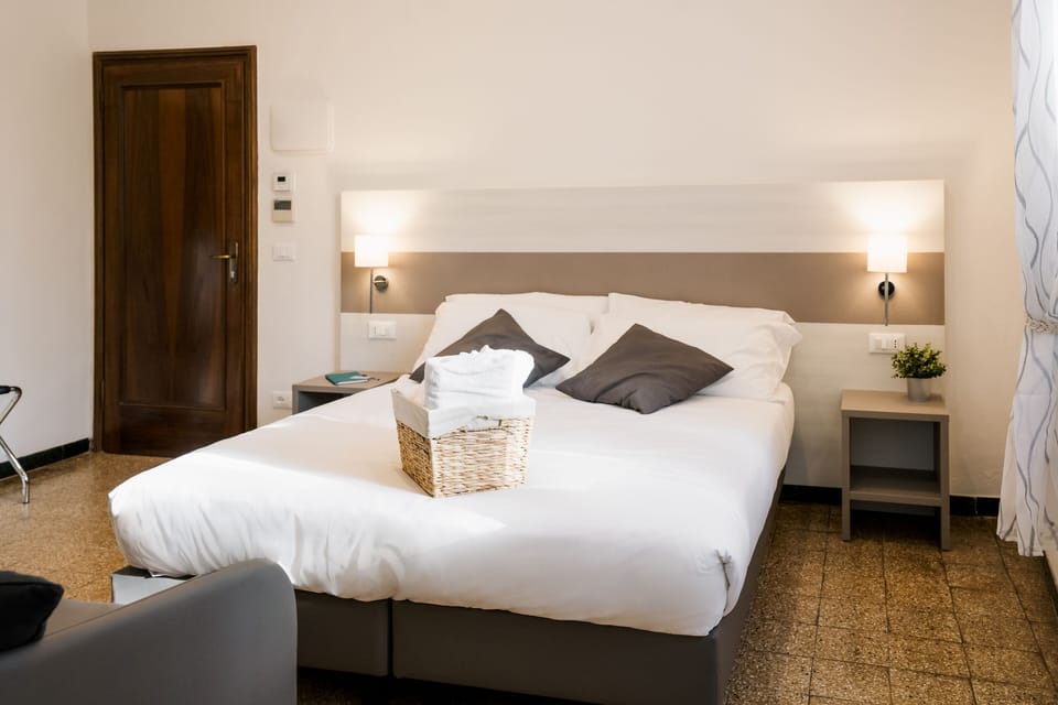Comfort Triple Room | Minibar, in-room safe, desk, laptop workspace