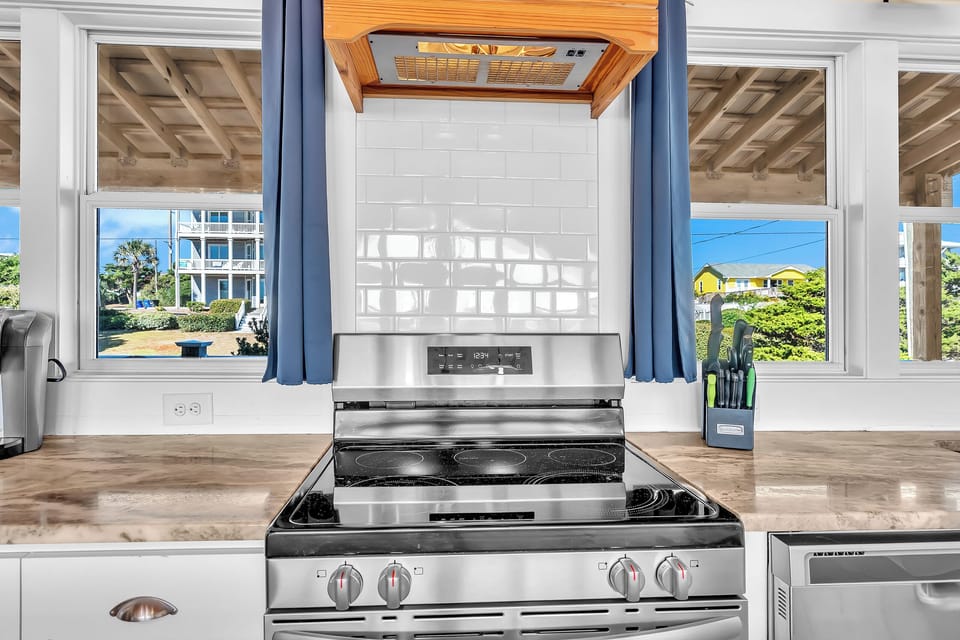 Cook your favorite meals on this modern electric range while enjoying ocean views through large windows above the sink.