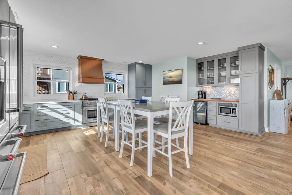 Your spacious kitchen invites culinary adventures with gleaming countertops, modern appliances, and a perfect island for morning coffee or evening wine.