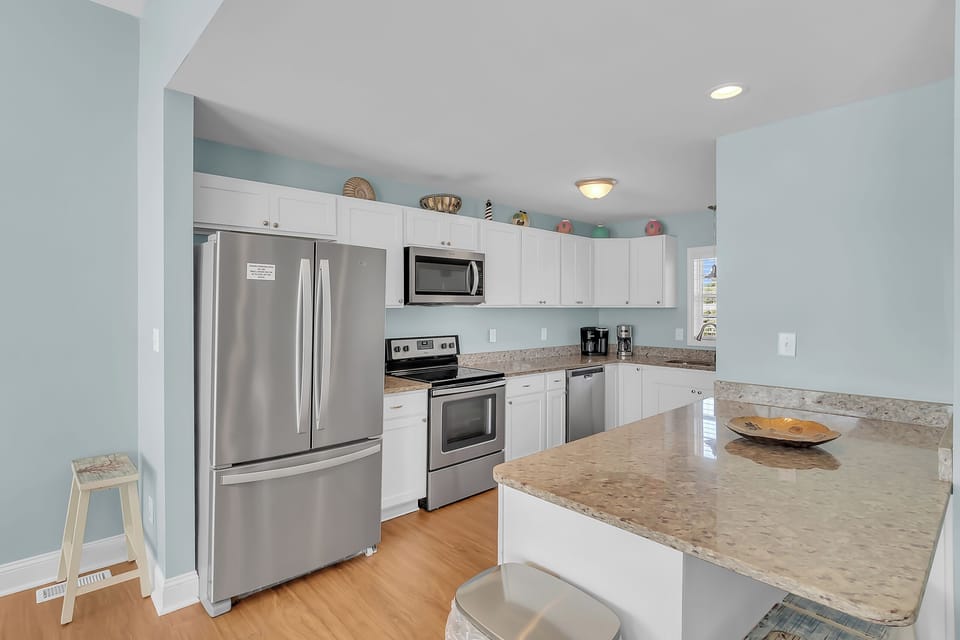 Your fully equipped kitchen features stainless steel appliances, granite countertops, and everything you need to create memorable meals during your stay.