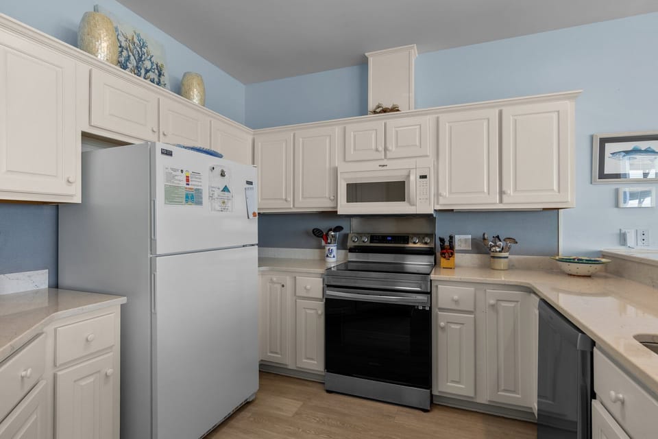 Your fully equipped kitchen invites culinary adventures with modern appliances and ample counter space for preparing memorable meals.