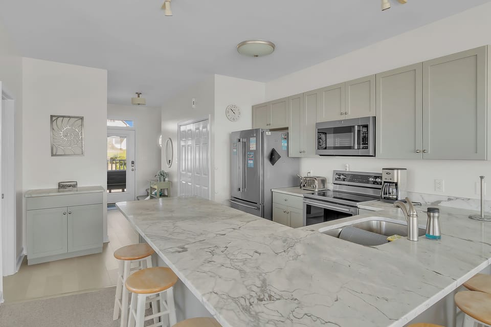 Your spacious kitchen features modern appliances and marble countertops, perfect for preparing meals during your stay.