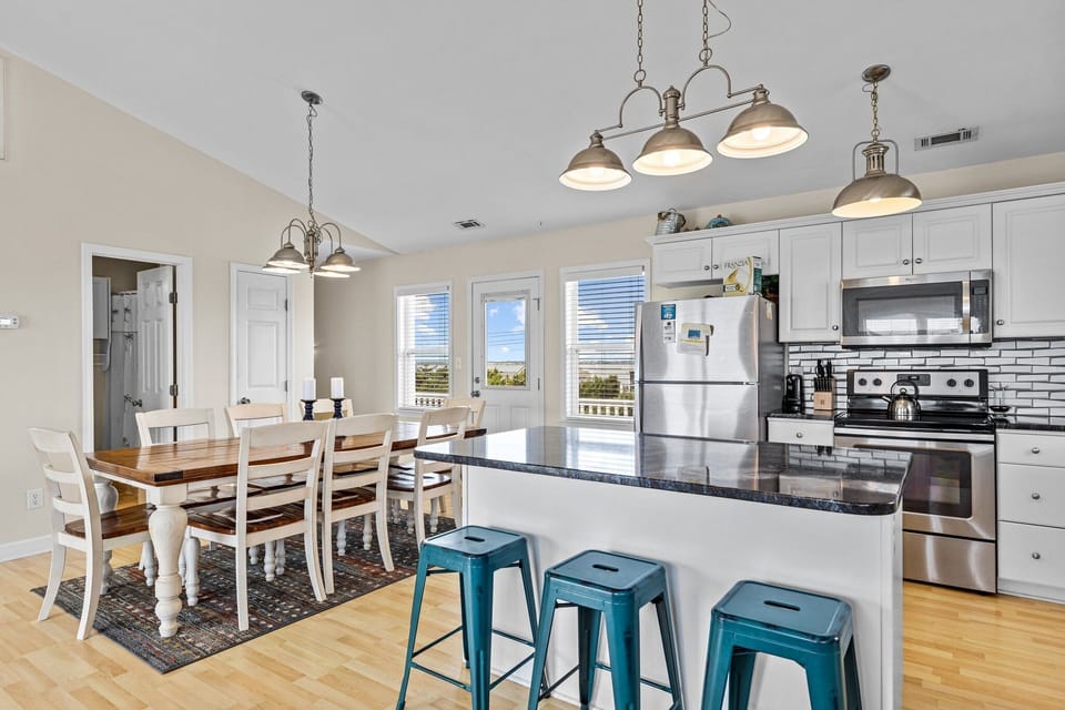 Your bright, open kitchen flows seamlessly into the dining area, creating the perfect space for cooking together and sharing meals while enjoying natural light.