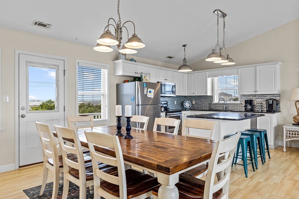 Gather around this gorgeous farmhouse table where meals become memories, with your fully equipped kitchen ready for cooking adventures.