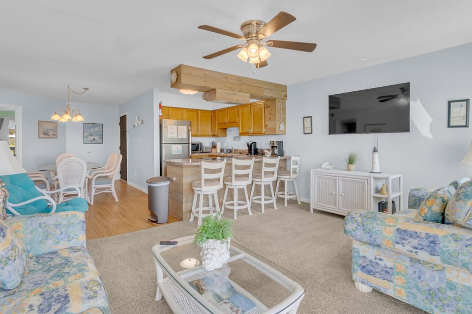 Relax in your bright, open living space where comfortable seating and a fully equipped kitchen create the perfect home base for your getaway.