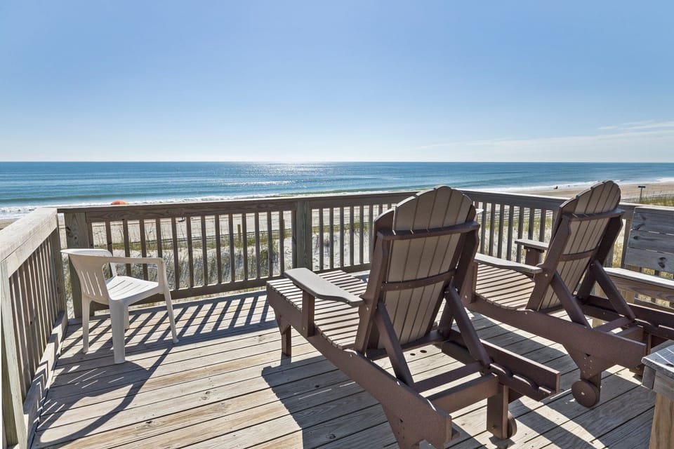 Soak up endless ocean views from your private deck, where comfortable Adirondack chairs invite you to relax with morning coffee or sunset cocktails.