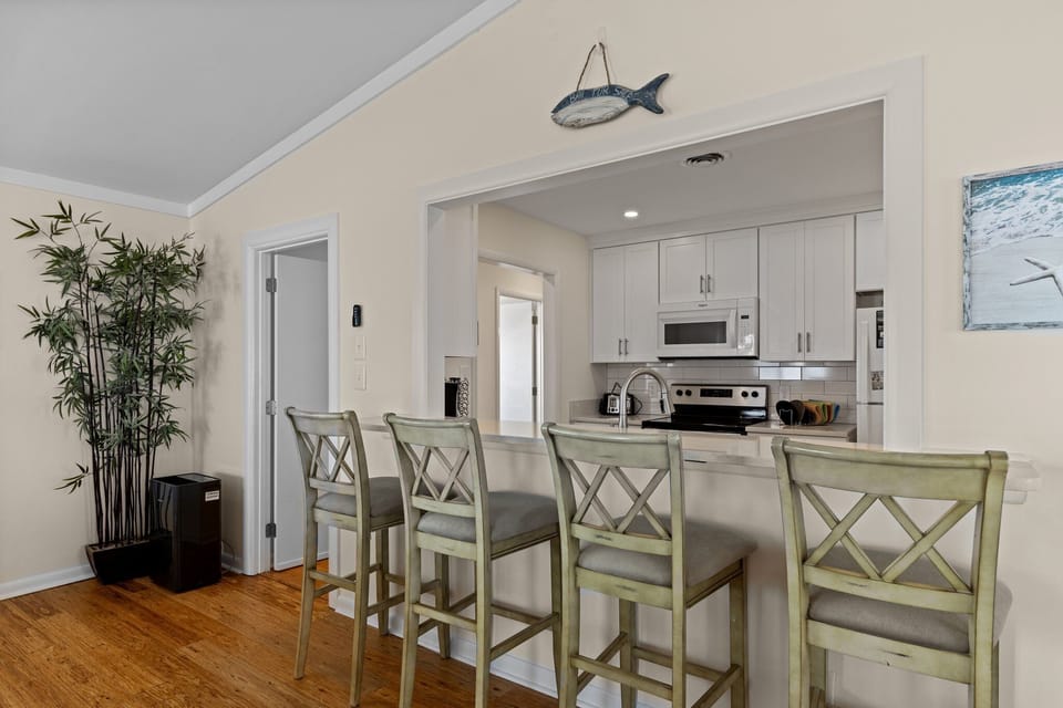 Gather with loved ones at your spacious kitchen island with comfortable bar seating, perfect for morning coffee or evening conversations.