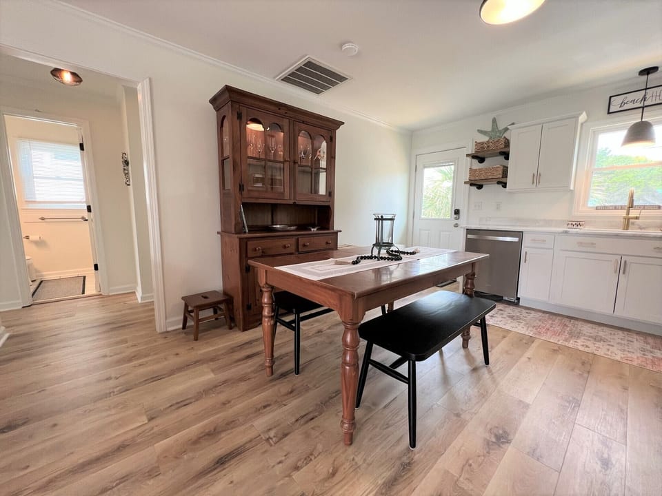 Gather around your spacious farmhouse kitchen with its rustic charm and modern convenience, perfect for memorable meals together.
