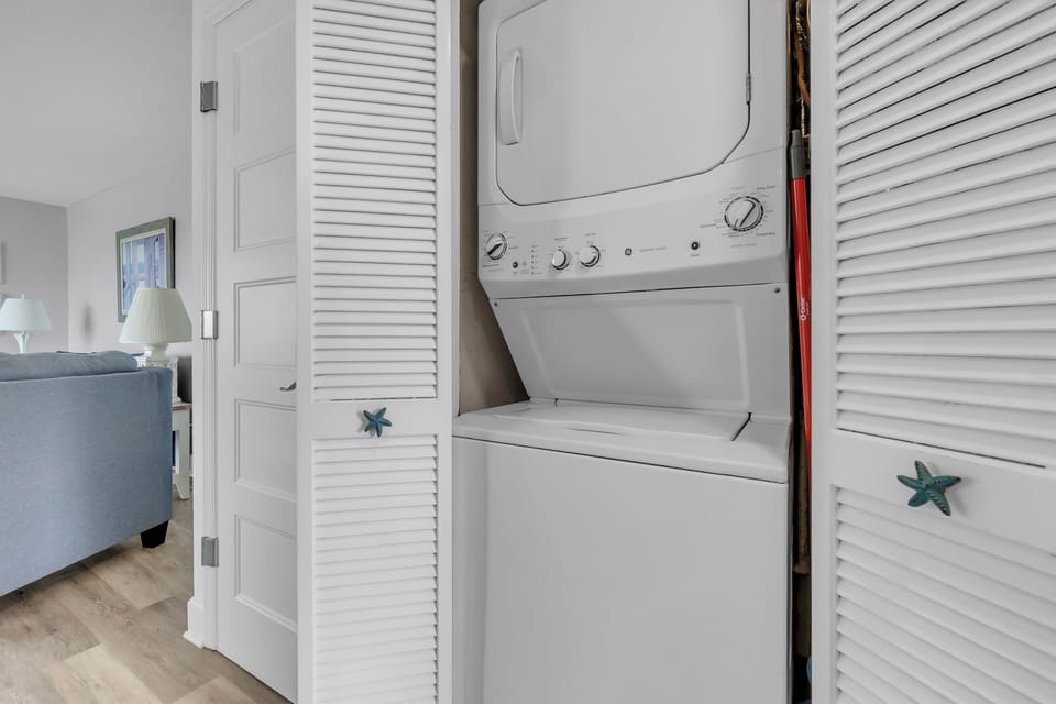 Your in-unit washer and dryer tucked behind charming louvered doors keeps your vacation wardrobe fresh and ready.