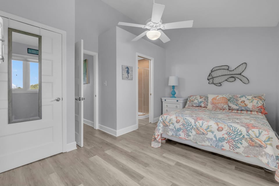Drift into coastal dreams in your serene bedroom, where ocean-themed linens and charming nautical touches create the perfect seaside sanctuary.