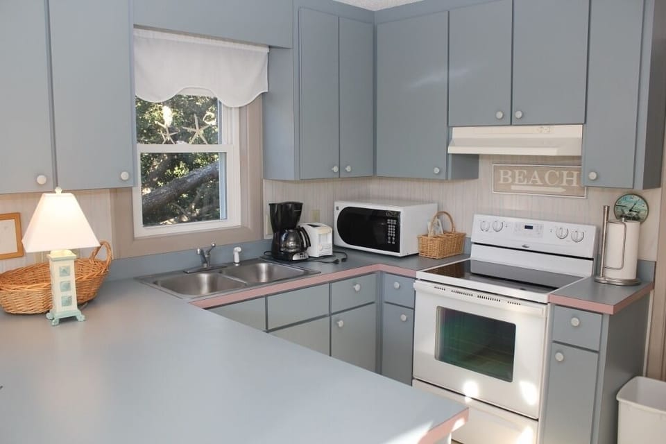 Your fully equipped kitchen awaits with everything you need to prepare meals, from morning coffee to family dinners during your stay.