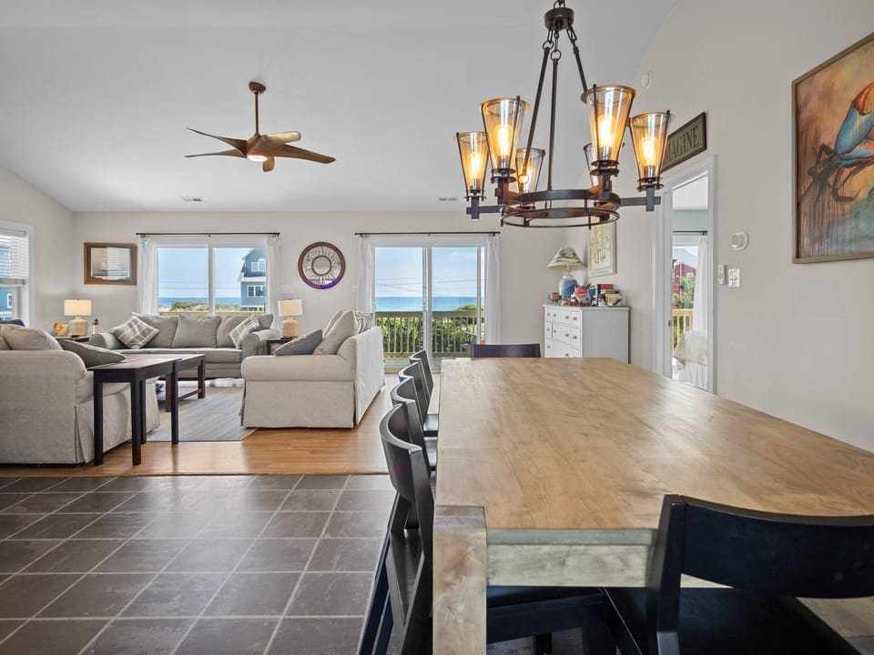 Gather around this beautiful dining table with stunning ocean views flowing through every window, creating the perfect backdrop for your coastal retreat.