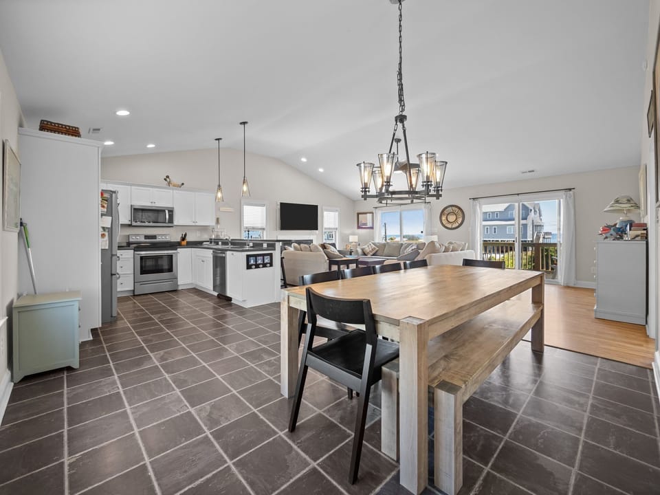 Your spacious open-concept kitchen flows seamlessly into the living area, perfect for gathering with family while preparing meals together.
