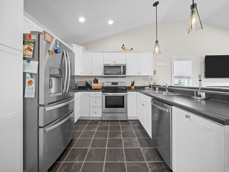 Your spacious kitchen features stainless steel appliances, granite countertops, and everything you need to create memorable meals during your stay.
