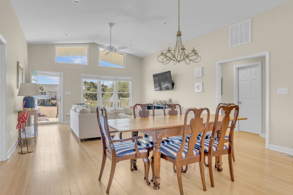 Gather around this elegant dining table for memorable meals with your group, while natural light streams through large windows into your open living space.
