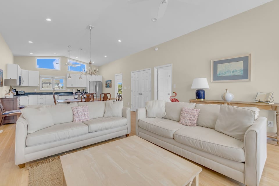 Settle into your spacious open-concept living area with plush sofas and a fully equipped kitchen perfect for memorable meals together.