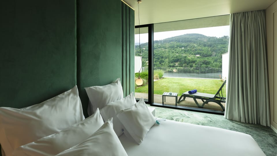 Suite, River View | Minibar, in-room safe, desk, soundproofing