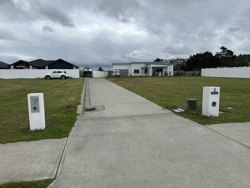 Driveway into property.  White House to your right.