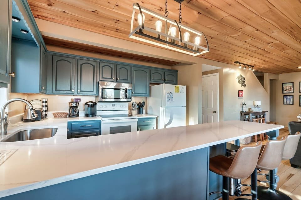 Kitchen is stocked and ready for your cooking adventures! Includes Keurig and regular coffee pot, among other appliances. Enjoy breakfast at the bar counter with 3 stools.