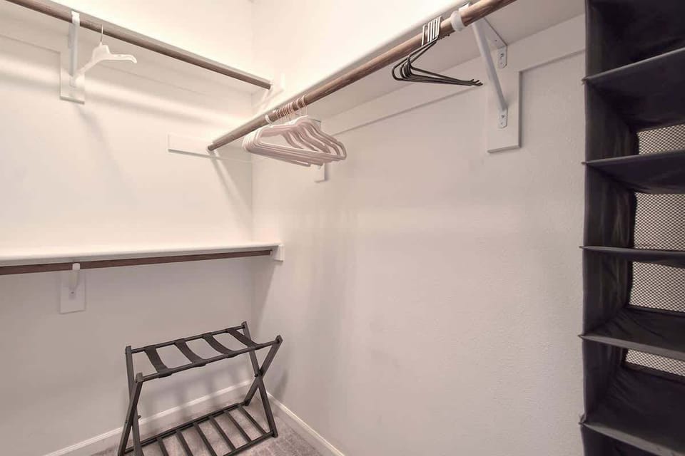 Unpack with ease in the large walk-in closet offering generous storage for extended stays.