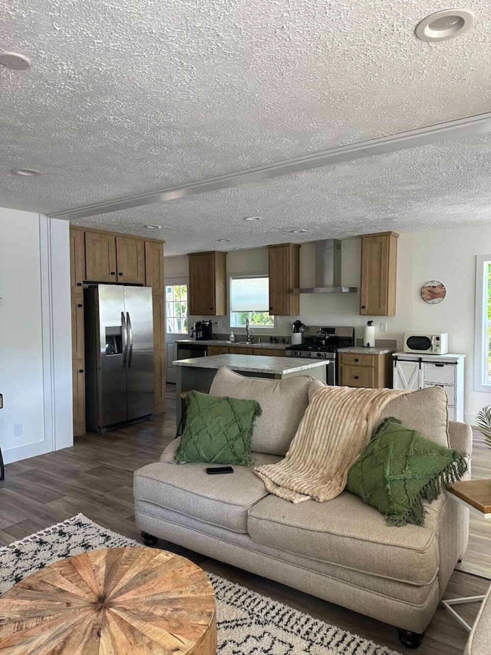 Living Room: Bright and airy space with modern decor and inviting seating for leisurely gatherings!