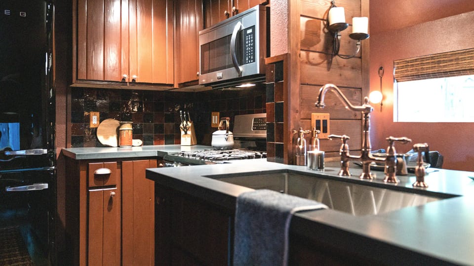 “There are multiple windows to enjoy morning sun, gas fireplace, tasteful art and books, spacious SMEG refrigerator and well stocked kitchen to whip up any culinary cravings..." - Freewyld Traveler