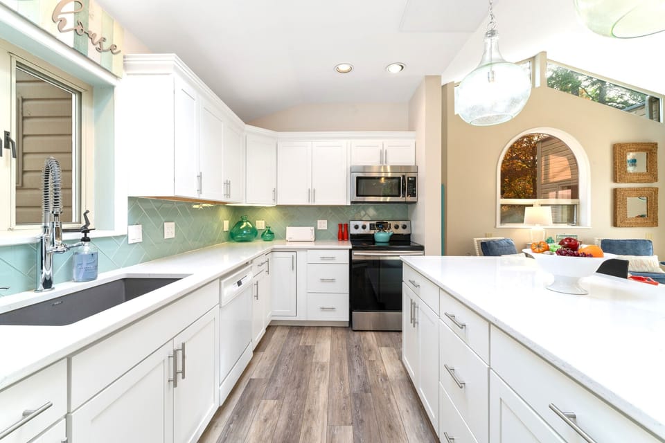 Spacious kitchen with ample counterspace and breakfast bar with three additional seats at the counter.