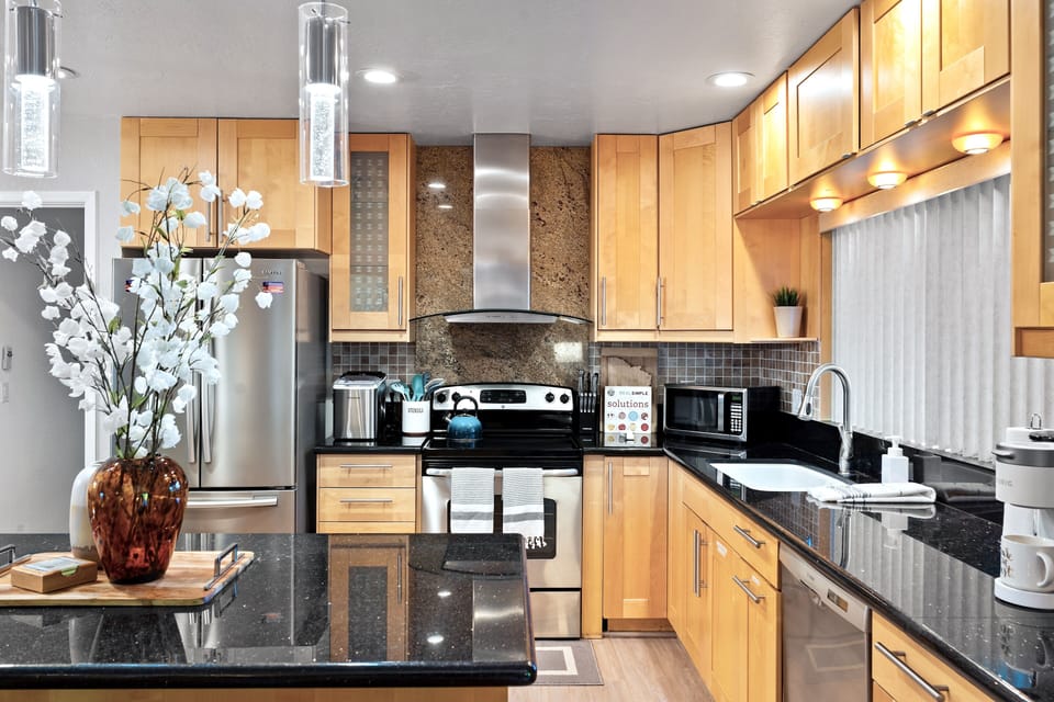 Fully stocked kitchen with stainless steel appliances
