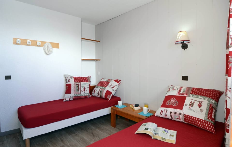 There's a bedroom with 2 Single beds and a mezzanine with Bunks.