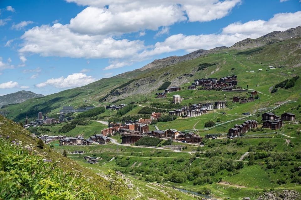 The resort in summer, green meadows and chairlifts offering a completely different kind of mountain escape.