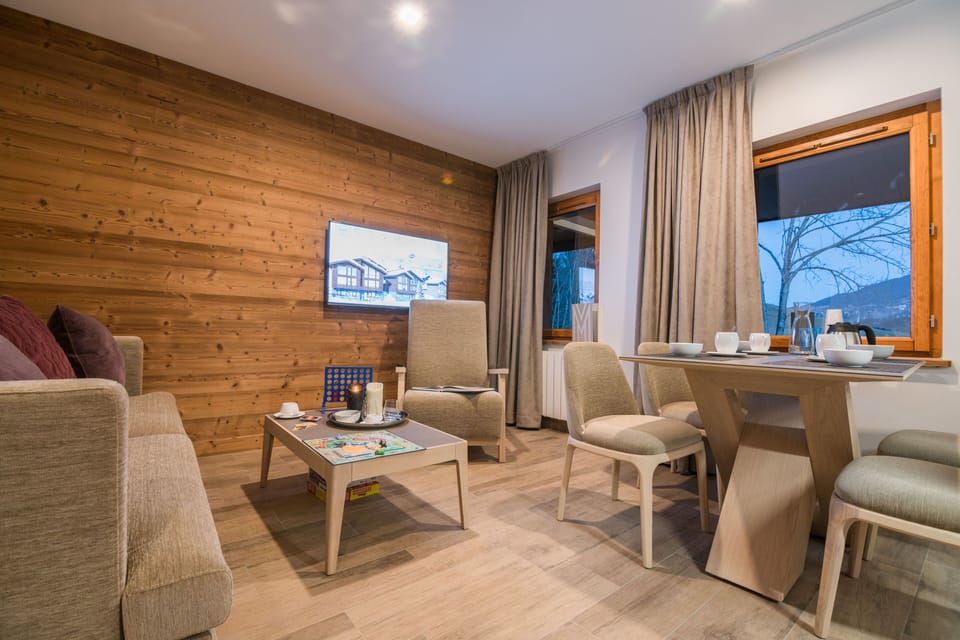 The living room features a comfortable sofa bed.