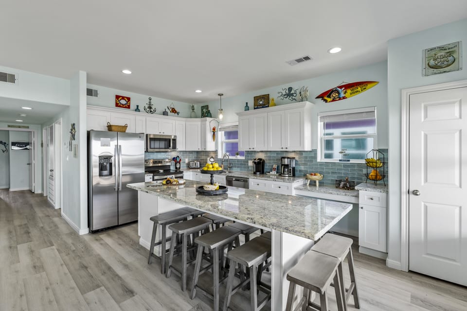 Enjoy cooking, eating or even board games together at the large island.