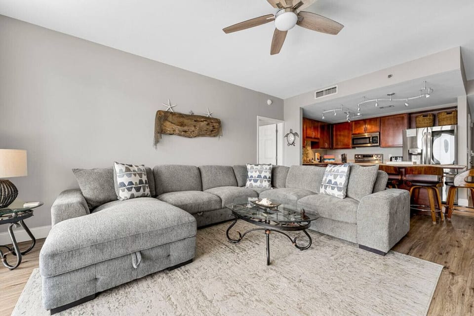 Living Area with Ocean View, Flat Screen TV, Sleeper Sofa and Private Balcony Access