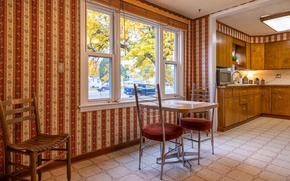 Breakfast nook with large windows is the perfect spot for a morning cup of coffee