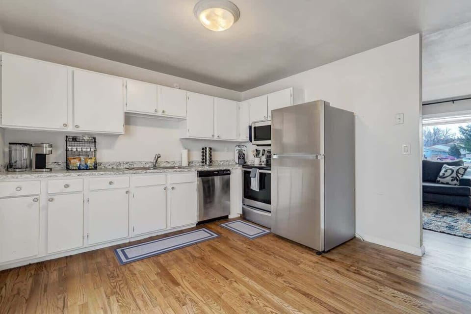 Discover the joy of cooking in our fully equipped kitchen, where a stove, microwave, and refrigerator make meal prep a breeze.