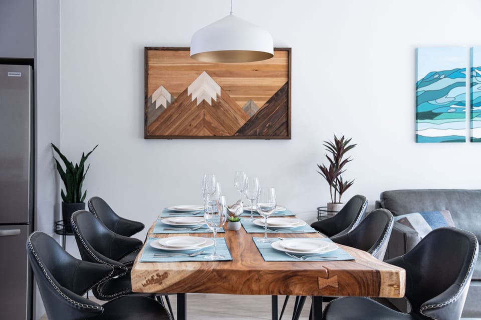 Rustic art and warm woods bring nature into every corner of this unit