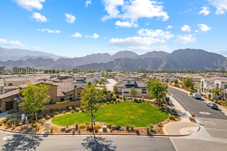A serene community offering an open dog park, lush green spaces, and breathtaking mountain views. Perfect for relaxing strolls and outdoor living.
