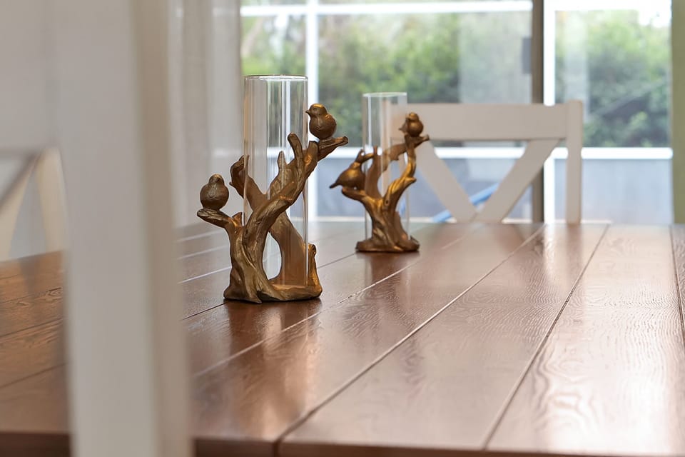 Dining room overlooking the pool with space for 8