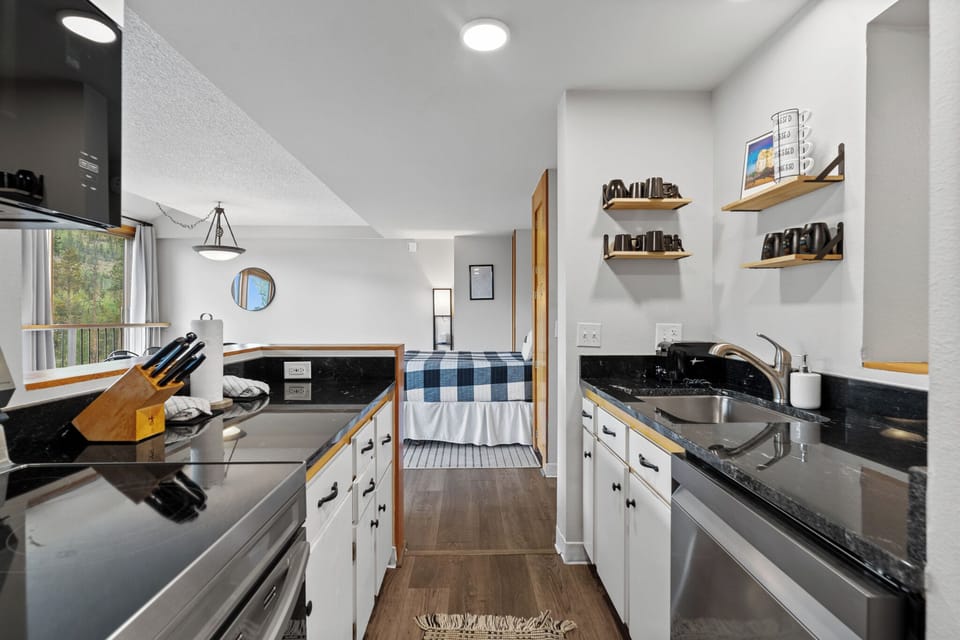 The newly updated full-sized kitchen is stocked with all the essential cookware and tableware to make a meal away from home.