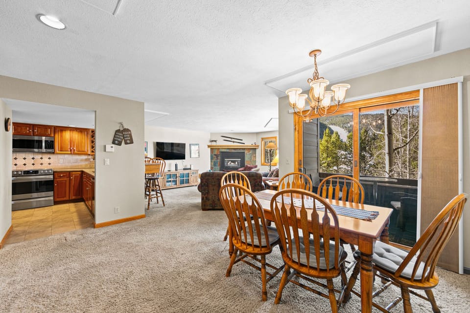 Gather around your spacious dining table with mountain views while the kitchen beckons for home-cooked meals and cozy evenings by the fireplace.