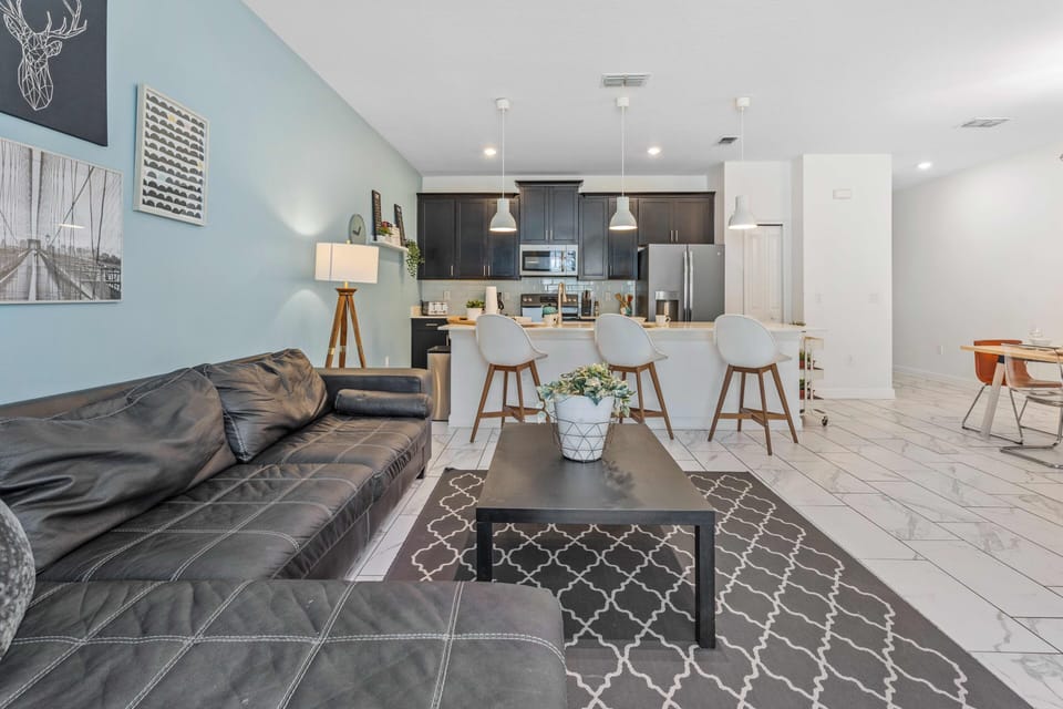 Marvelous living area of the apartment in Davenport - Cosy sofas - Elegantly decored living area - Large bright windows of the living area with Mesmerizing views - Beautifully furnished floor - Availability of TV and Netflix