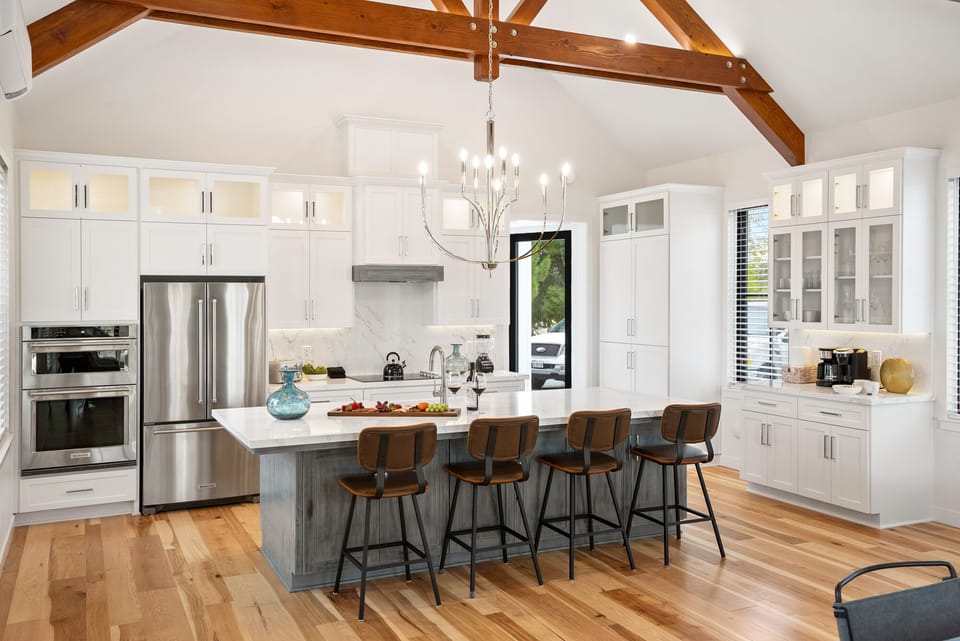 High quality appliances, surfaces like hardwood floors, and brig