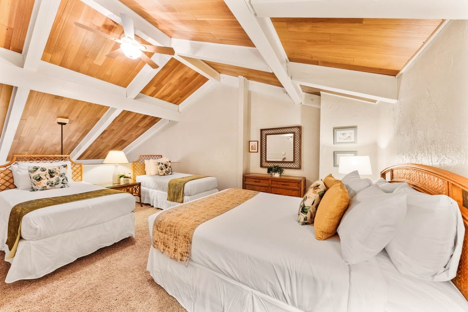 Island inspired room featuring two Twin beds and a Queen bed