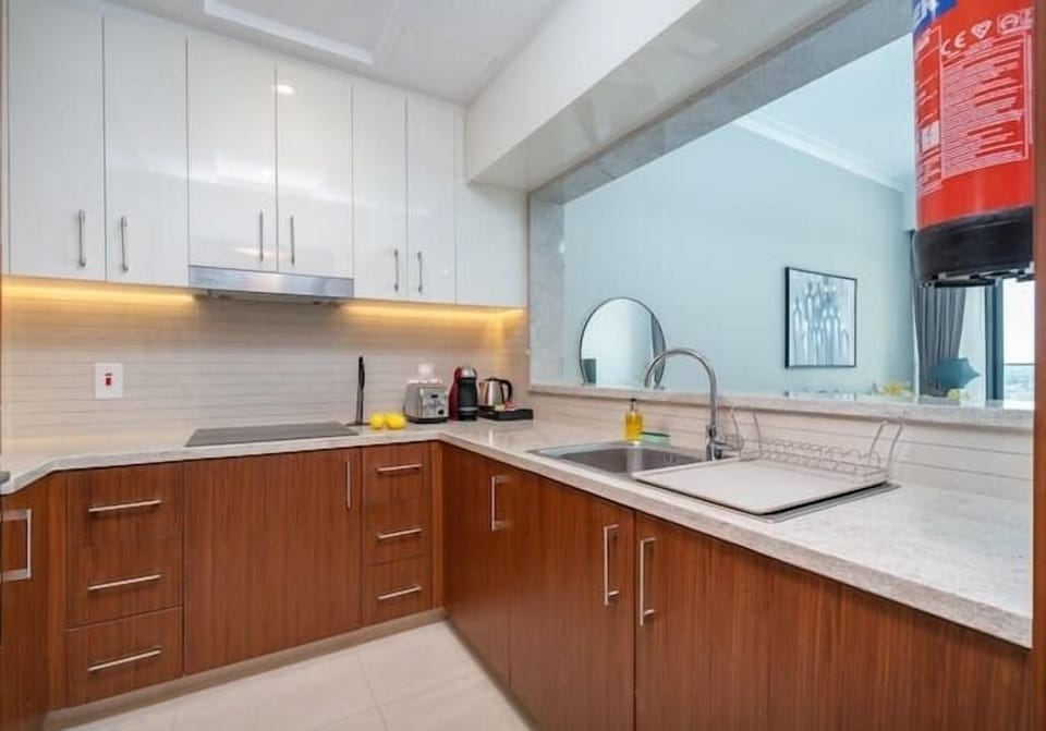 Luxury Apartment | Private kitchen | Full-size fridge, microwave, oven, stovetop
