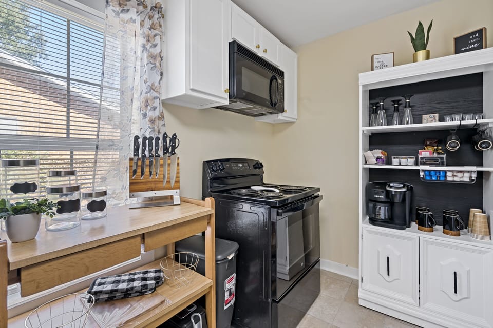 Fully equipped kitchen with a stocked beverage center. 